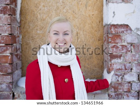 Laughing young woman watch on camera at day