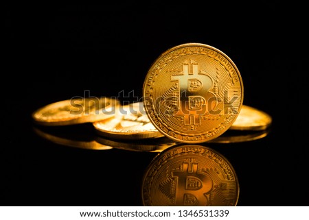 Bitcoin. Crypto currency Gold Bitcoin, BTC, Bit Coin. Macro shot of Bitcoin coins isolated on black background. 