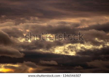 Clouds at Sunset. Layers of clouds intersecting in various shapes and colors.