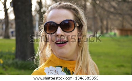blonde woman in sunglasses