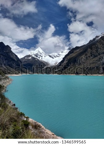 Laguna Paron, Huaraz, Peru. A blue-green lake in the Cordillera Blanca on the Peruvian Andes. At 4185 meters above sea level, it's surrounded by snowy peaks and a pyramid mountain. 