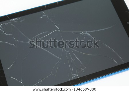 tablet with broken screen on white background