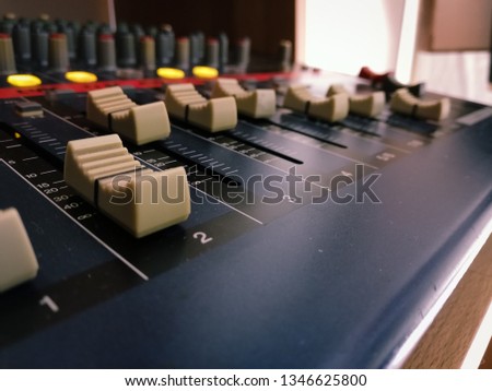 Close Up of Fader on Audio Mixer in a Home Studio used by music producer. 