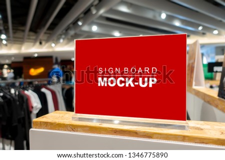 Mock up horizontal blank signboard with clipping path to show promotion or price at fashion clothes shop, Red screen in acrylic frame, empty space for insert text or advertising
