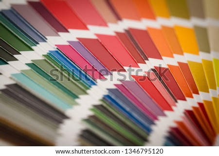 front view close up of multicolor color pantone  paper spectrum sampler texture background pattern