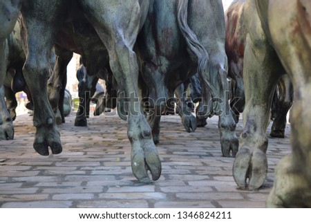 Sculpture of bulls running the Sanfermin Bull Run Royalty-Free Stock Photo #1346824211
