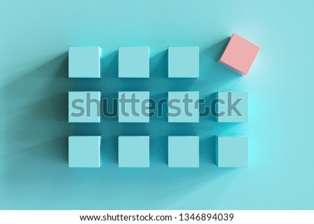outstanding pink box among blue boxes on blue background. minimal flat lay contept