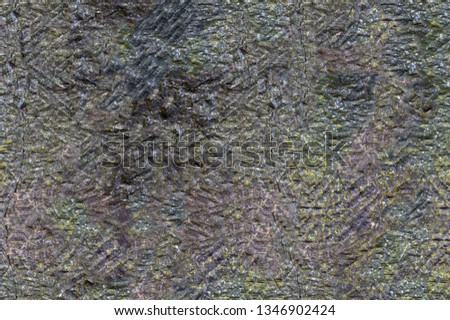 Seamles photo texture of a gray stone wall with little scratches and moss
