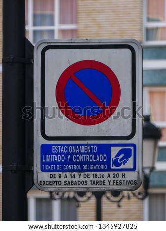 'Prohibited to park' sign unless paying at certain hours