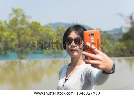 traveling Asian woman at the outdoor in daytime