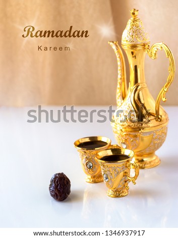 Ramadan Kareem Greeting Card. Still life with traditional golden arabic coffee set with dallah and cup. White background. 