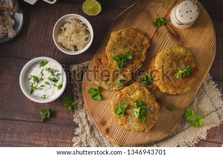 Simple cheap food with garlic mayo, fresh herbs, pickles and cabbage