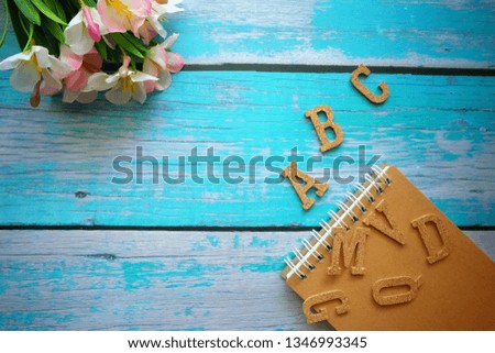 Close up of English alphabet on wooden table.