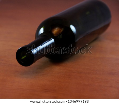 empty wine bottle on wooden table