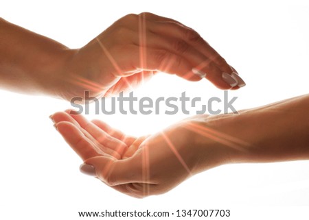light in the hands isolated on white background Royalty-Free Stock Photo #1347007703