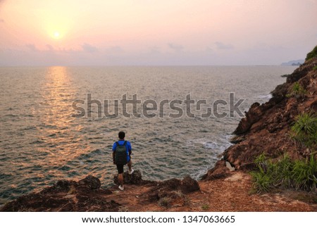 Silhouette a man on sunset background at (Lan Hin Se Chom Pu), Chantaburi in Thailand.