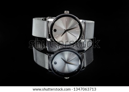 Men's luxury wristwatch on black background 