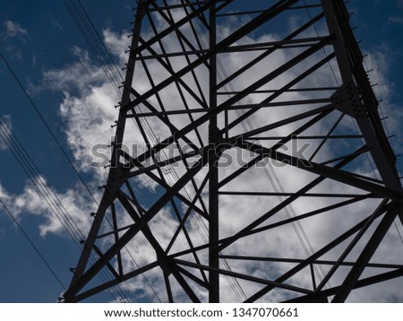 Image of power pole with cloudy background