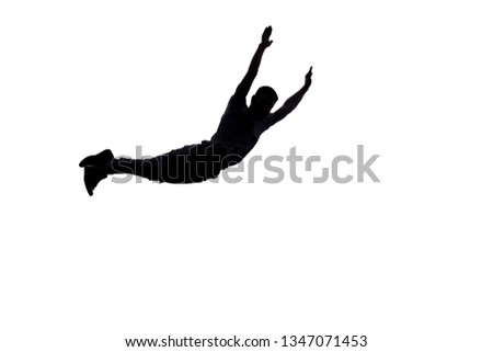 Man in studio is doing freestyle break dance jump isolated on white
