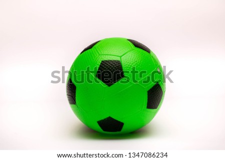 Colorful ball. Green baby ball for soccer on the white background.