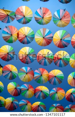 Colorful umbrellas background. Colorful umbrellas in the sky. Street decoration

