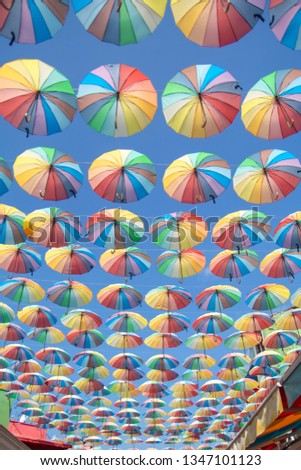 Colorful umbrellas background. Colorful umbrellas in the sky. Street decoration
