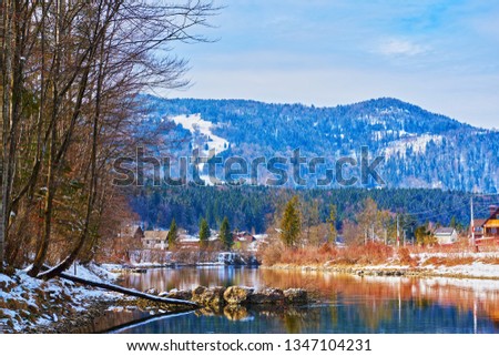 Scenic picture-postcard landscape with lake Traun, forest and mountains  in Austrian Alps. Beautiful view in winter. Austria, Bad Goisern