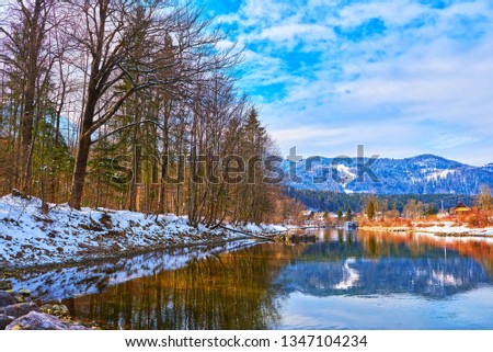 Scenic picture-postcard landscape with lake Traun, forest and mountains  in Austrian Alps. Beautiful view in winter. Austria, Bad Goisern