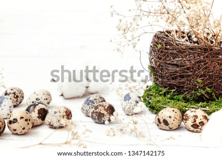 Easter decoration with egg in nest cup on white wooden background. Easter concept. Flat lay top view copy space. Spring greeting card
