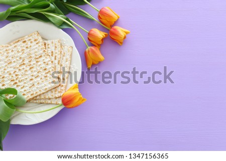 Pesah celebration concept (jewish Passover holiday). Translation for Hebrew Text over plate (Pesah) Passover