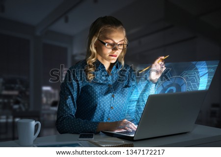 Attractive woman working on laptop and lock icon out of screen. Mixed media
