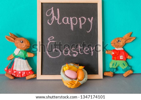 Easter picture with bunnies, a bird and a sign with the inscription. Decorative concept