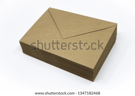 Pile of brown standard sized envelopes. It is made of ecological materials. It is classical eco design of every day use product