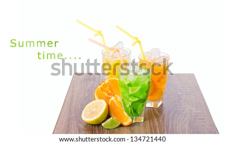 cocktails and slice of fresh tropical fruits on wooden table on white background