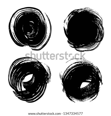 Abstract textured black circle strokes on rough paper set isolated on a white background