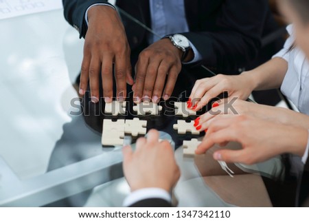 closeup.business partners accounting for the puzzle pieces