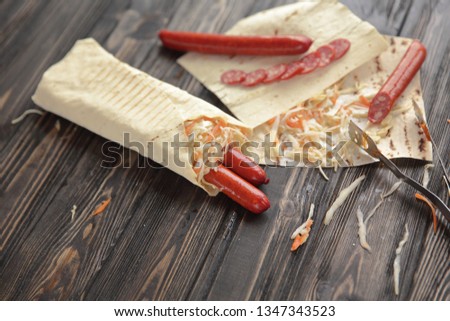 lavash with spicy sausage and vegetables.photo with copy space