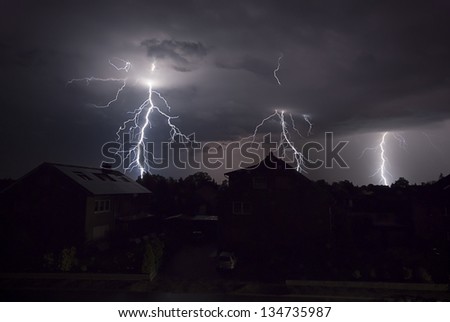 The picture shows a thunderstorm at night.