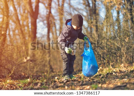 Recycle waste litter rubbish garbage trash junk clean training. Nature cleaning, volunteer ecology green concept. Young men and boys pick up spring forest at sunset. Environment plastic pollution Royalty-Free Stock Photo #1347386117