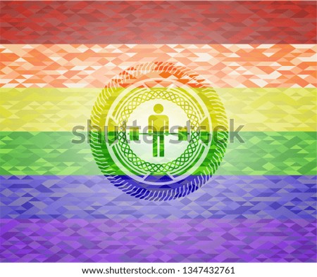 deadlift icon inside emblem on mosaic background with the colors of the LGBT flag