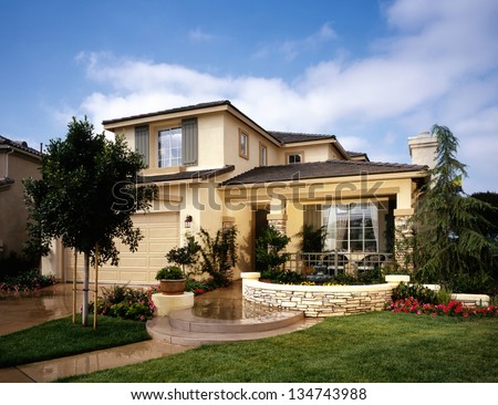Home Exterior of House with Landscaping Royalty-Free Stock Photo #134743988