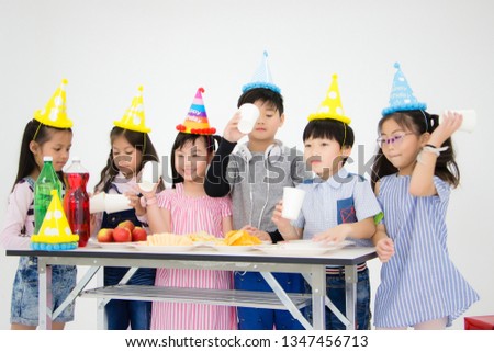 Children are eating delicious food in a fun party in Thailand. Concept of a Asian children's holiday party
