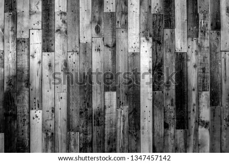 Texture of the wooden fence. Black and white photo background.