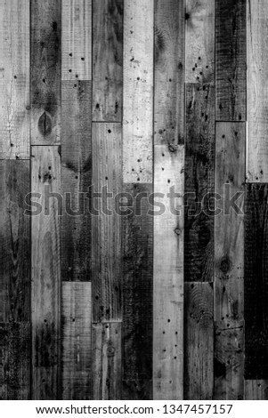 Texture of the wooden fence. Black and white photo background.