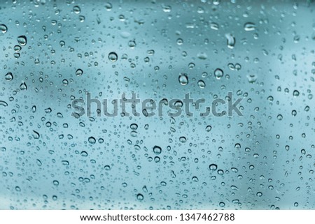 rain drops, water drops on glass in spring. abstract background
