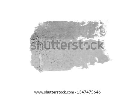 Smear and texture of lipstick or acrylic paint isolated on white background. Stroke of lipgloss or liquid nail polish swatch smudge sample. Element for beauty cosmetic design. Gray color