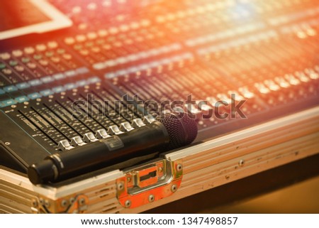 Professional audio mix sound control panel console and microphone / Sound technician and lights equipment