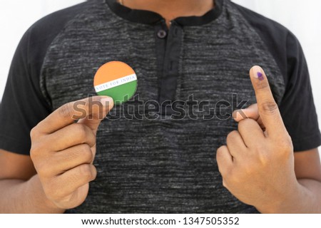 Concept of Indian election,Person holding sticker of vote for better Indian on isolated background.