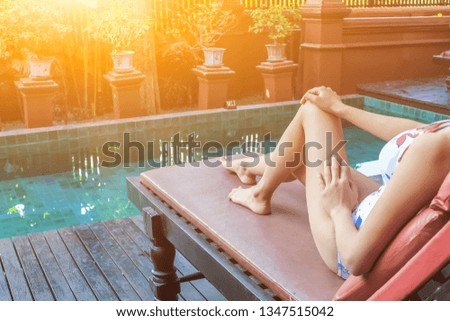 Soft Light & Smooth Focus,
Asian women are relaxing by the pool to escape the hot summer of Thailand and are happy to relax during the holidays.
Relaxation concept in summer
