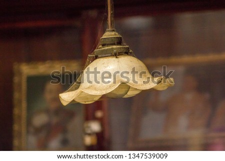 Old white lamps hung on top